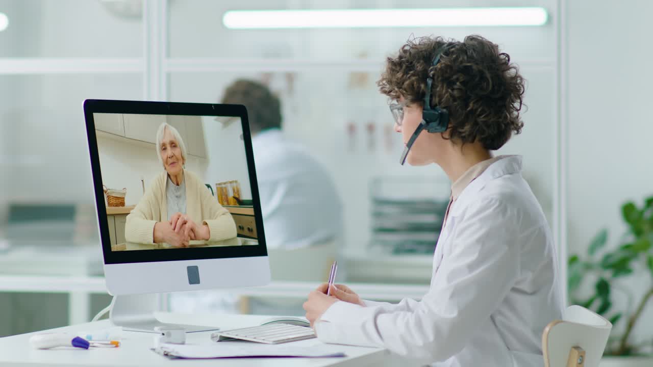 A licensed nurse on a video visit with a patient